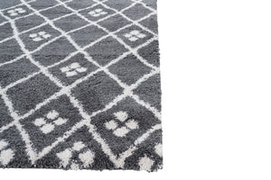 Grey checkered rug with paw print pattern on a white background
