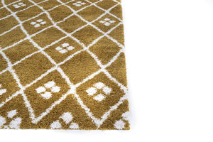 Gold and white patterned rug on a white background