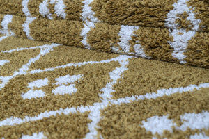Close-up of a textured gold and white patterned fabric
