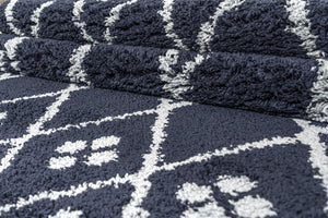 Navy blue textured rug with geometric pattern