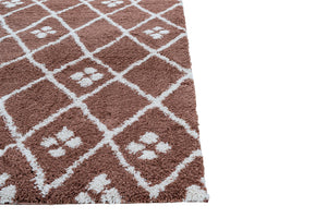 Brown and white checkered rug with paw prints on a white background