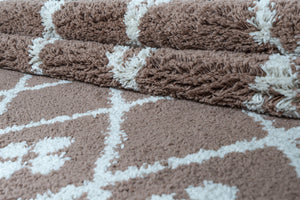 Brown textured towels on a matching brown and white geometric-patterned towel