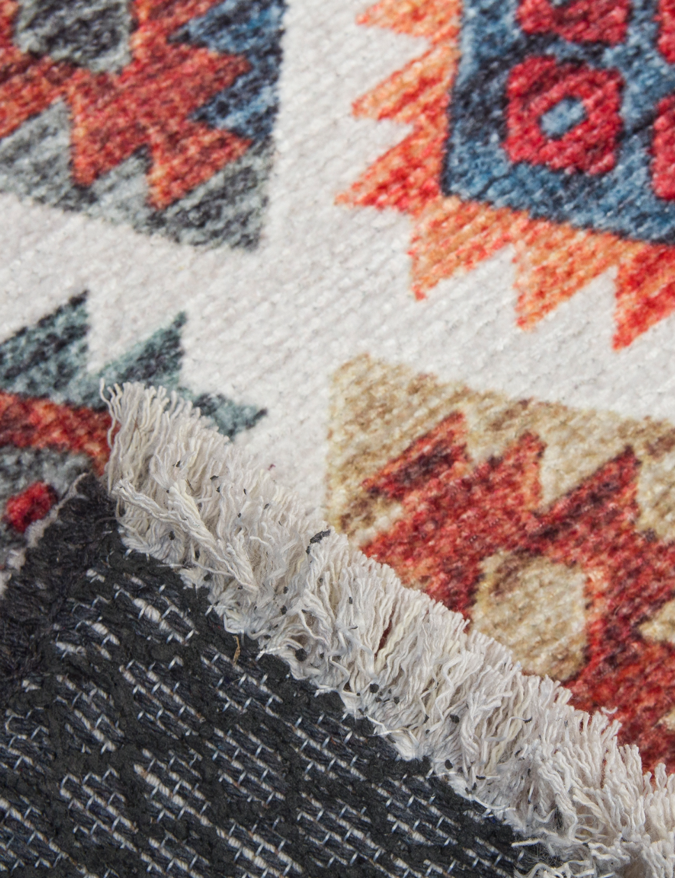 Close-up of a textured rug with geometric pattern