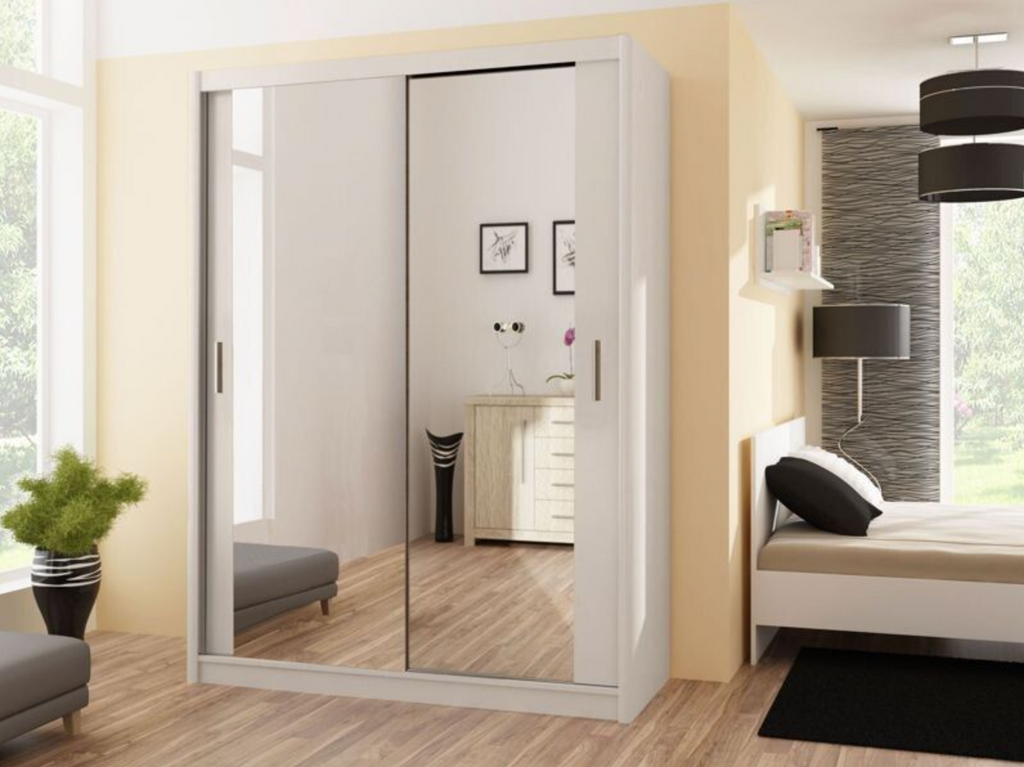 Modern bedroom with a mirrored wardrobe and bed.