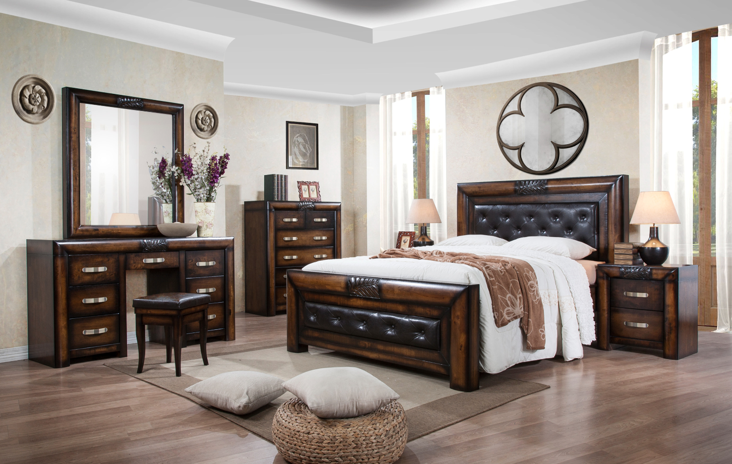 Wooden bedroom furniture set with bed, dresser, and desk in a well-lit room.