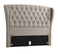 Gray tufted headboard with decorative buttons on a white background