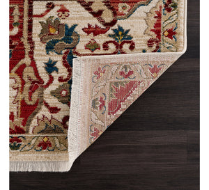 Decorative rug with intricate patterns on a wooden floor