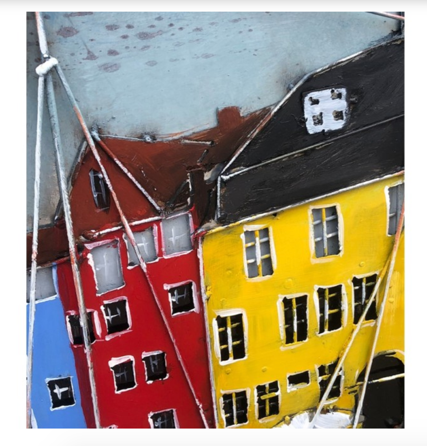 Colorful houses with red, yellow, and blue facades in a close-up view.