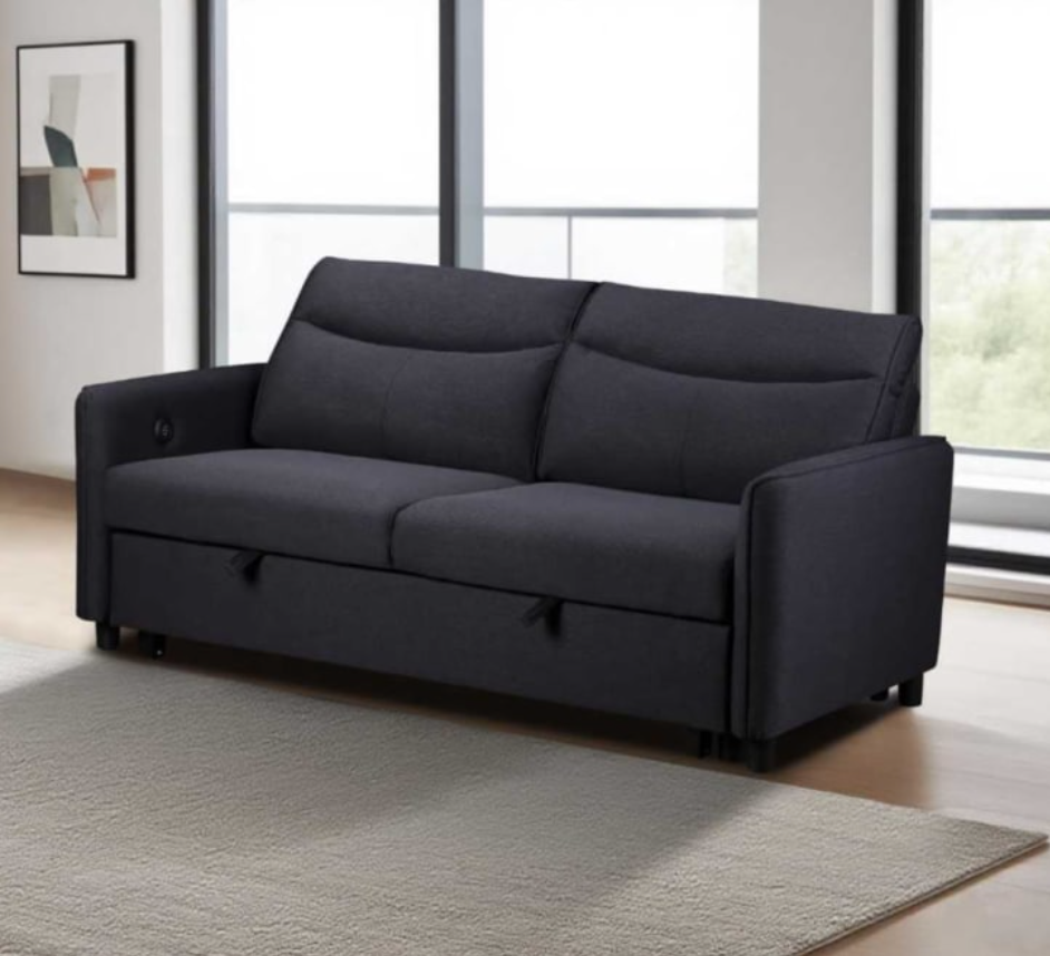 Black sofa bed in a room with large windows