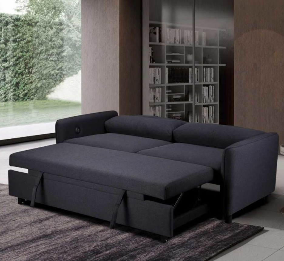 Black sectional sofa with storage drawers in a living room setting.