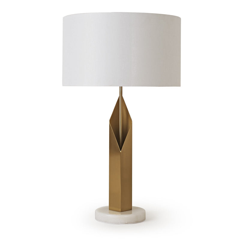 Table lamp with a gold base and white shade on a white background