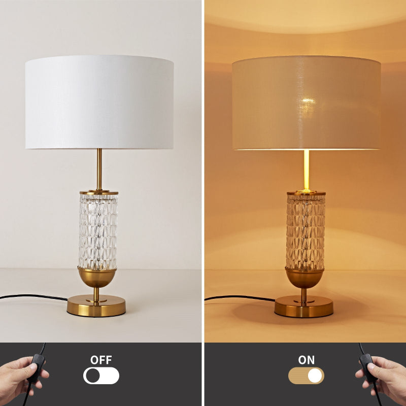 Table lamp with white shade and decorative base, shown off and on with a remote control.