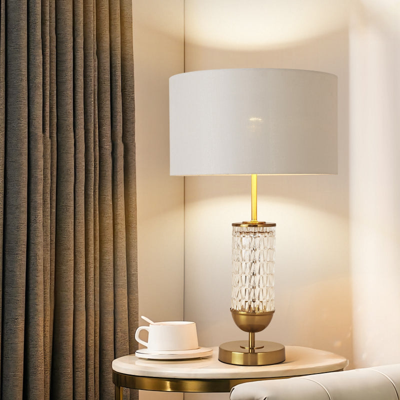 Decorative lamp on a side table with a curtain in the background
