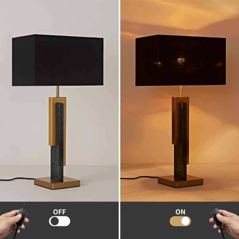 Table lamp with black shade and wooden base, shown off and on with remote control.