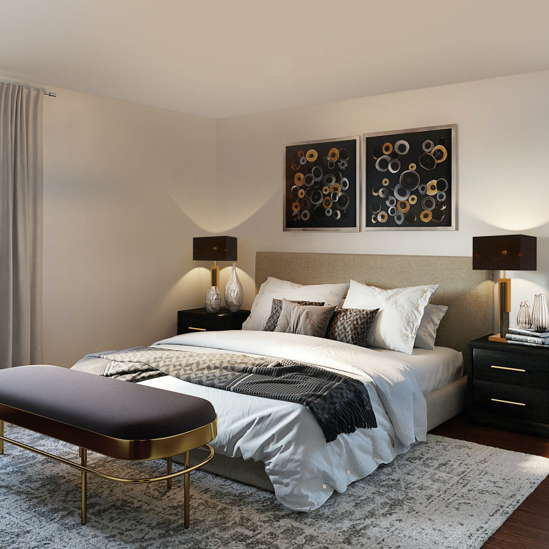 Modern bedroom with a bed, nightstands, and wall art.
