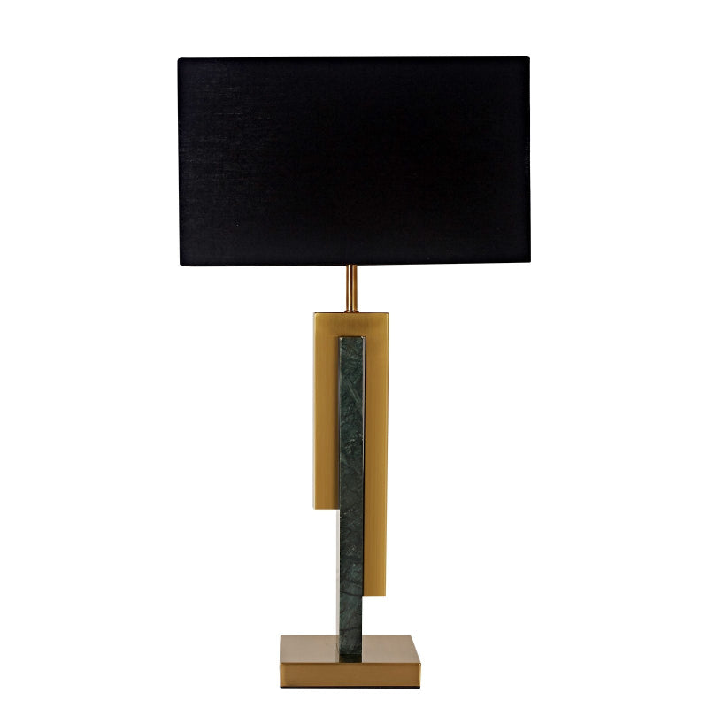 Table lamp with black shade, gold and marble accents on a white background