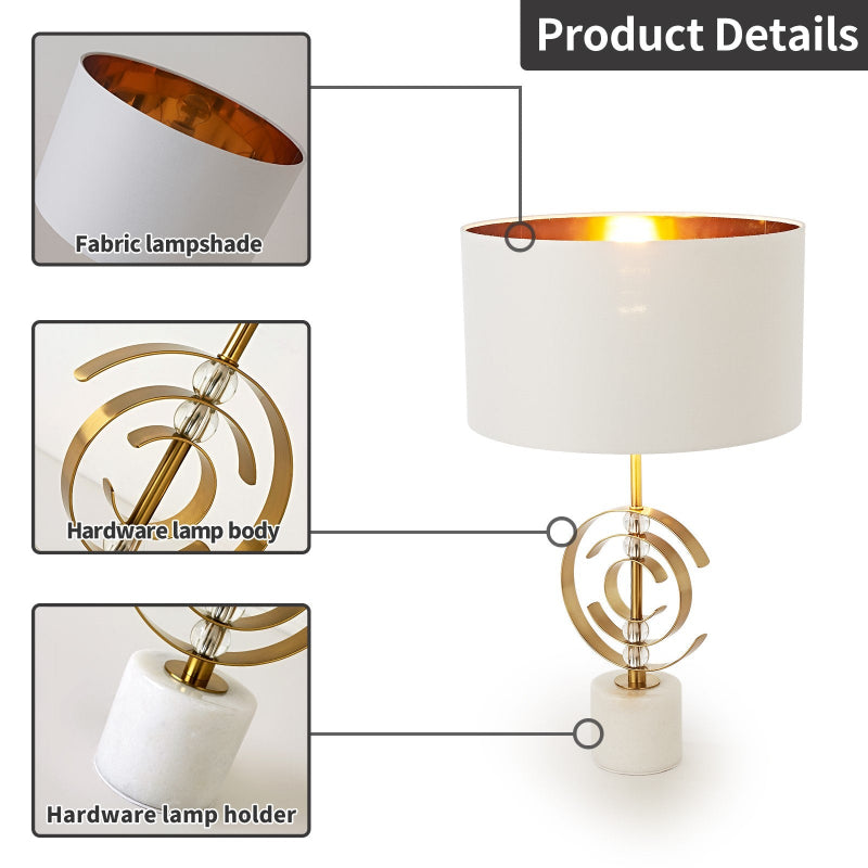 Lamp with fabric lampshade, gold hardware, and marble base labeled as product details.