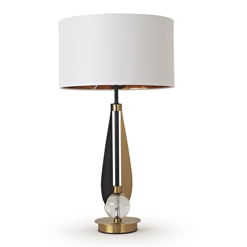 Table lamp with a white shade and metallic base on a white background