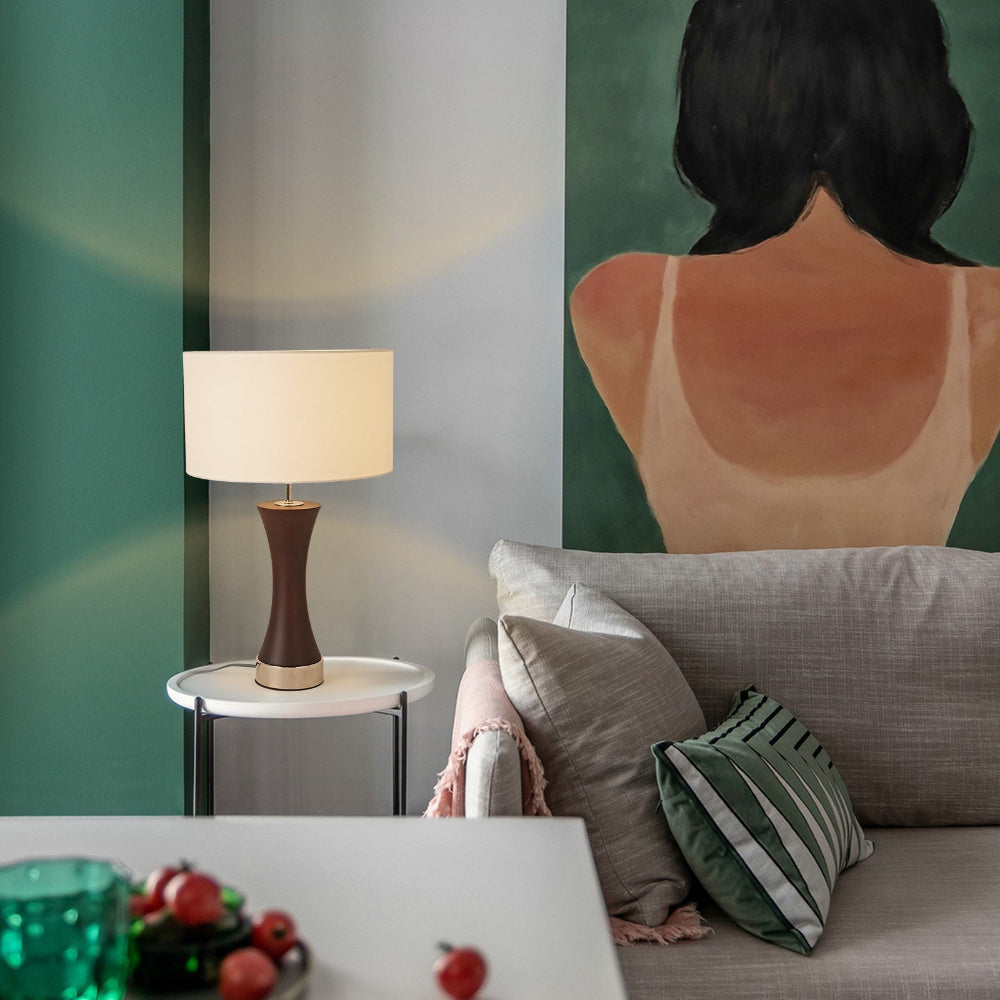 Living room with a lamp, sofa, and decorative items.