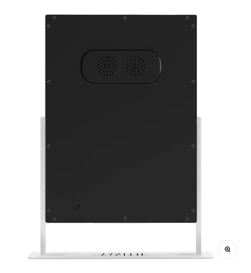 Black electronic device on a white stand with visible branding