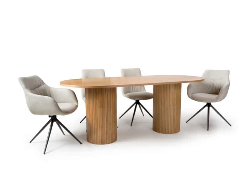 An oval dining table made of oak with a double slim panelled pedestal base.