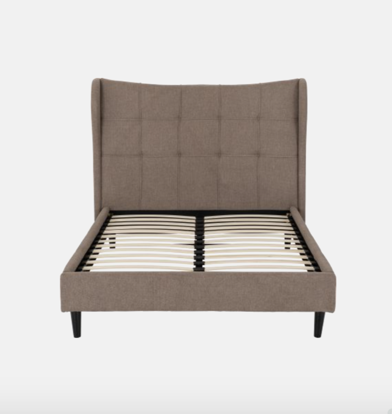 Brown upholstered bed frame on a white background