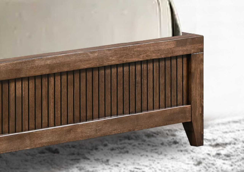 Wooden bed frame on a carpeted floor