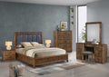 Wooden bedroom furniture set with bed, dresser, and nightstands in a room.