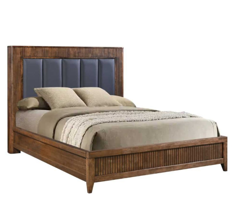 Wooden bed with upholstered headboard and bedding on a white background