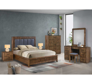 Wooden bedroom furniture set including bed, dresser, and vanity in a room with grey walls.