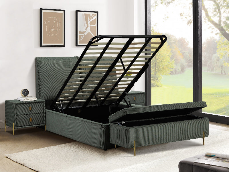 Green upholstered bed with open storage drawers in a room with large windows.