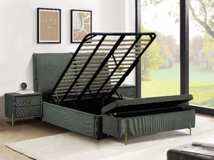 Green upholstered bed with open storage drawers in a room with large windows.
