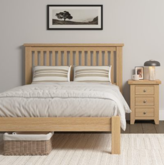 Wooden bed with matching nightstand in a bedroom setting