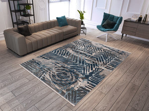 Living room with a patterned rug, sofa, and chair.