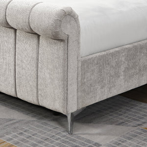 Beige upholstered bed with tufted design on a tiled floor