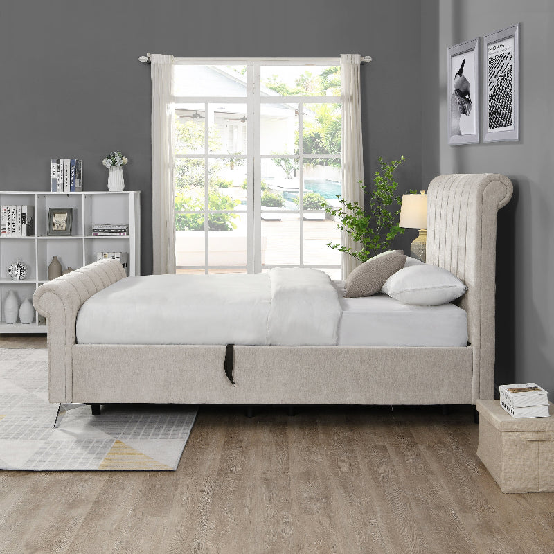 Beige upholstered bed in a room with a large window and decorative elements.
