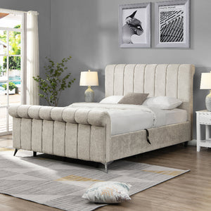 Beige upholstered bed in a bedroom with gray walls, white nightstands, and a rug.