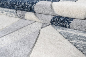 Collection of carpet samples in various patterns and colors.