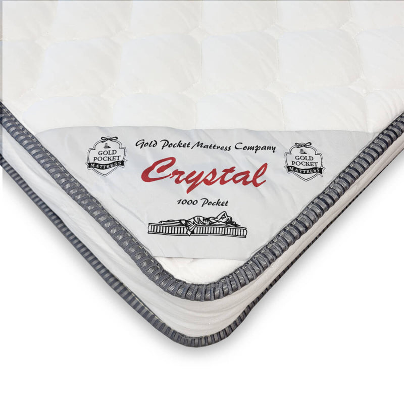 Mattress with 'Crystal' branding and 'Gold Pocket Mattress Company' logo on a white background
