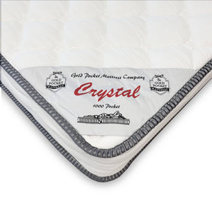 Mattress with 'Crystal' branding and 'Gold Pocket Mattress Company' logo on a white background