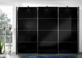 A modern sliding door wardrobe with polished chrome handles and a dark finish, possibly with glass or mirrored panels.